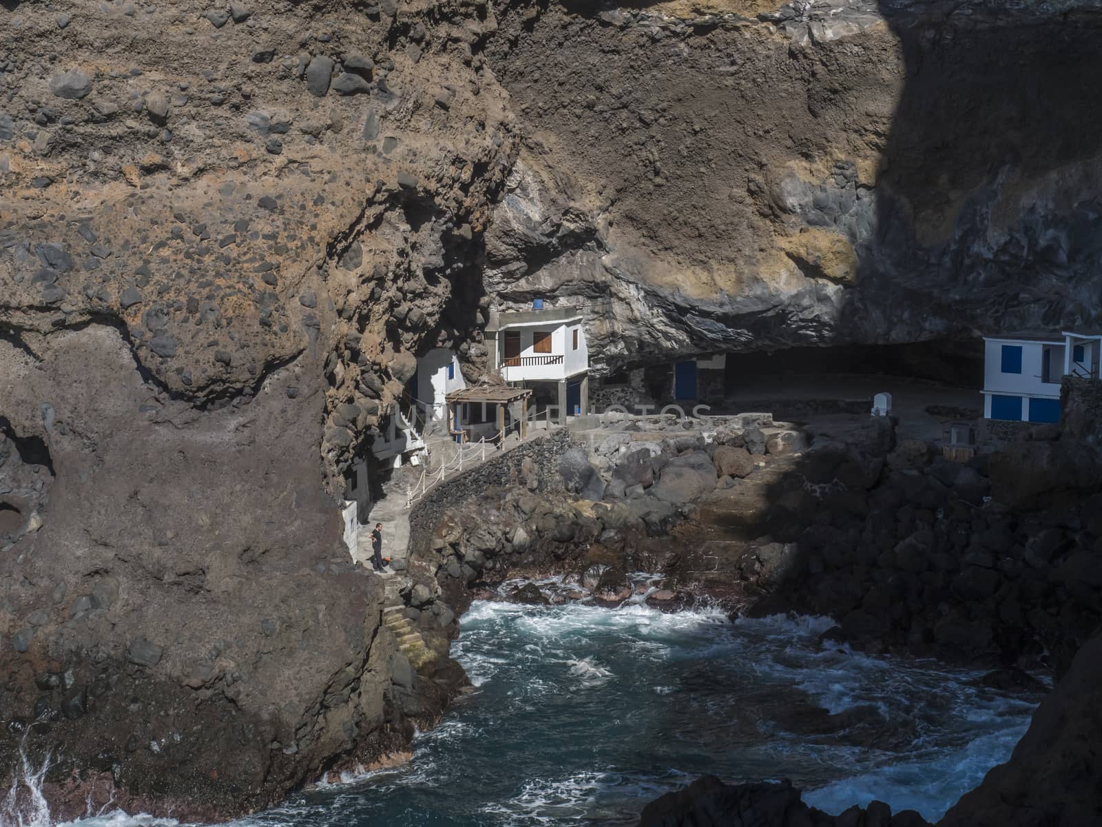 Cueva de Candelaria, Pirate cave Poris de Candelaria, small hidden fisherman village with white and blue houses, tourist attraction near Tijarafe, La Palma, Canary islands, Spain.