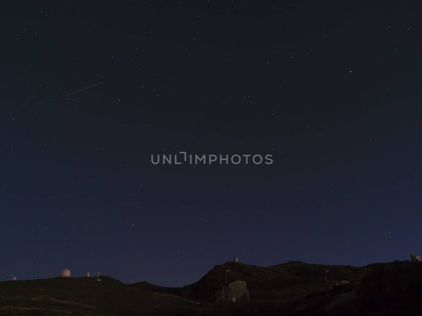 Night astrophotography, sky with stars at Roque de los Muchachos with telescopes of astronomical observatory, la Palma, Canary islands, Spain by Henkeova