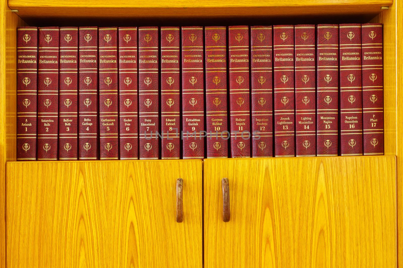 Haifa, Israel = August 14, 2019: Volumes 1 - 17 of the Encyclopedia Britannica, 1965 edition, on a wooden bookshelf
