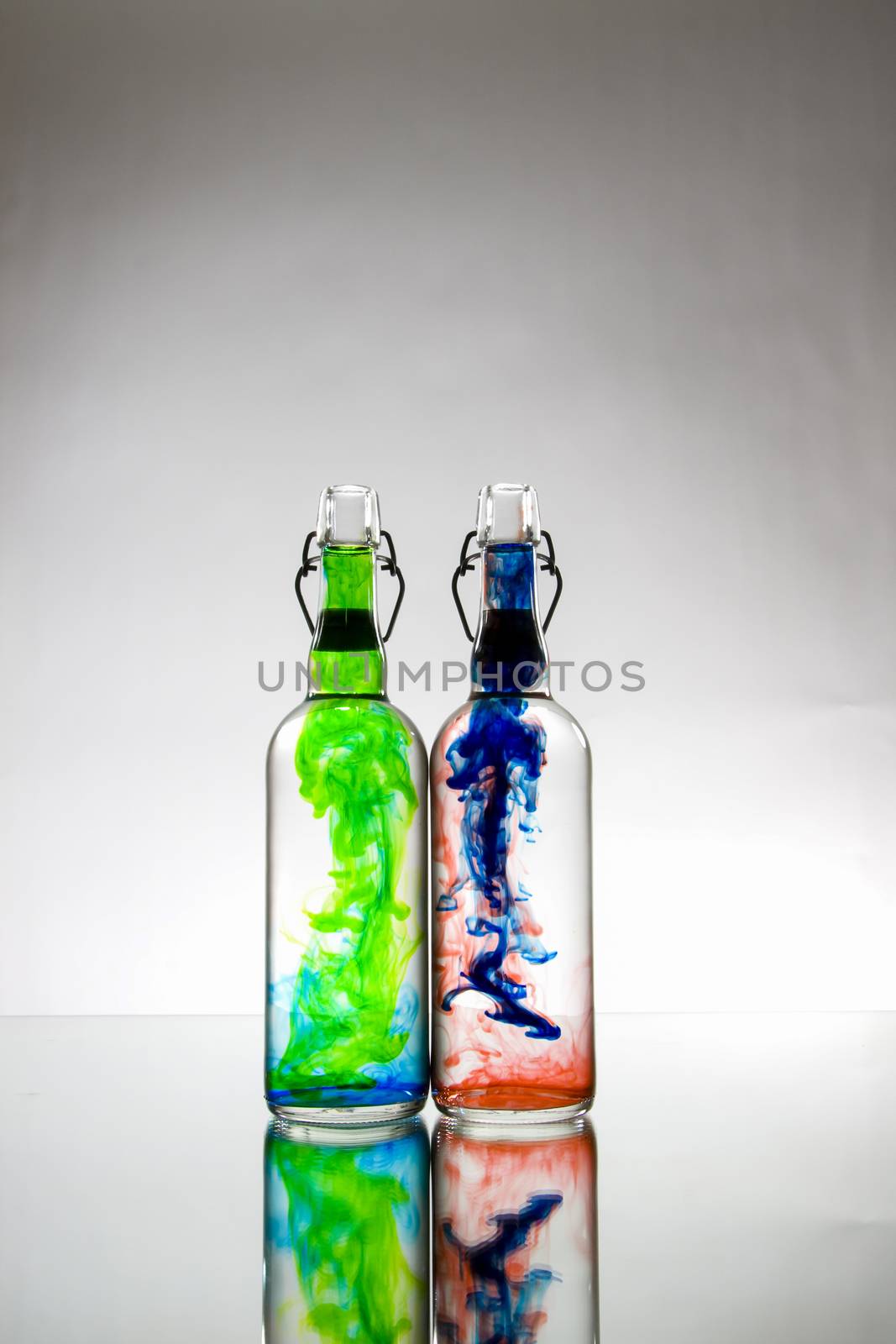 Bottles with color substance by applesstock