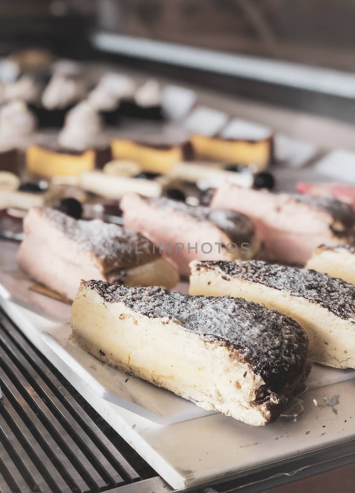 Homemade delicious cheesecake slice on wooden board