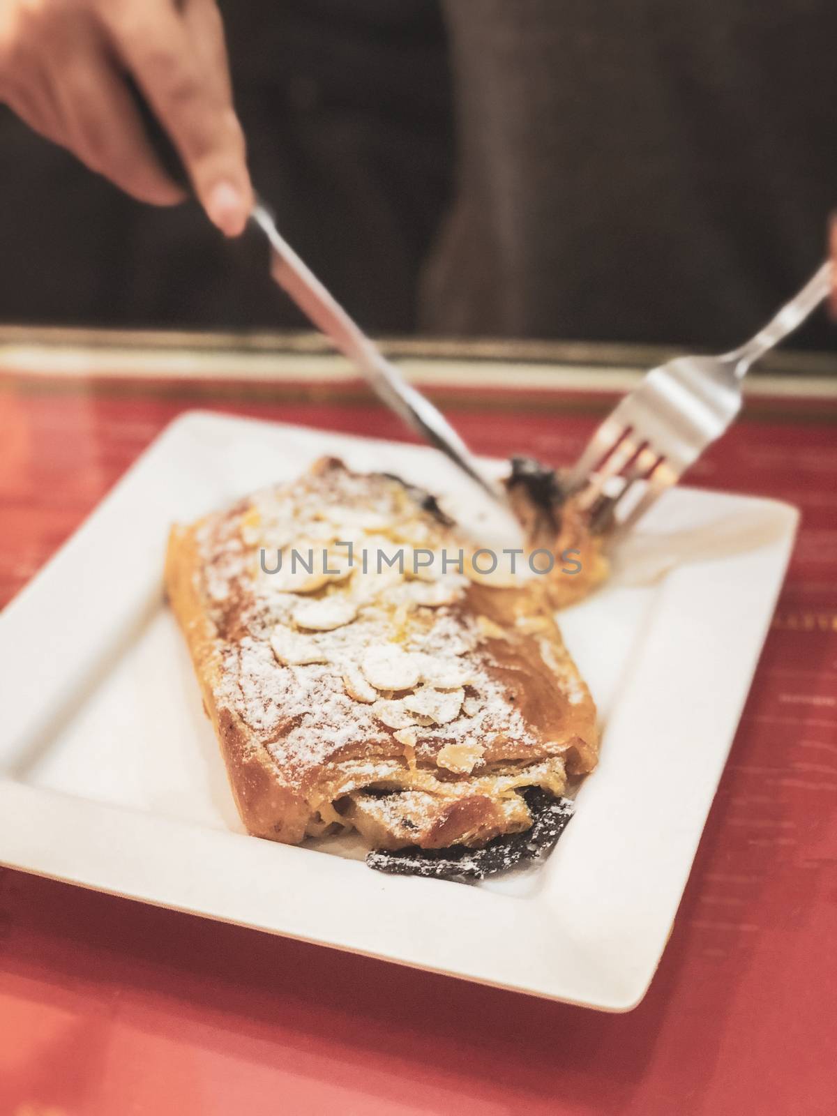 close up woman hands cutting bread for breakfast. by Benzoix