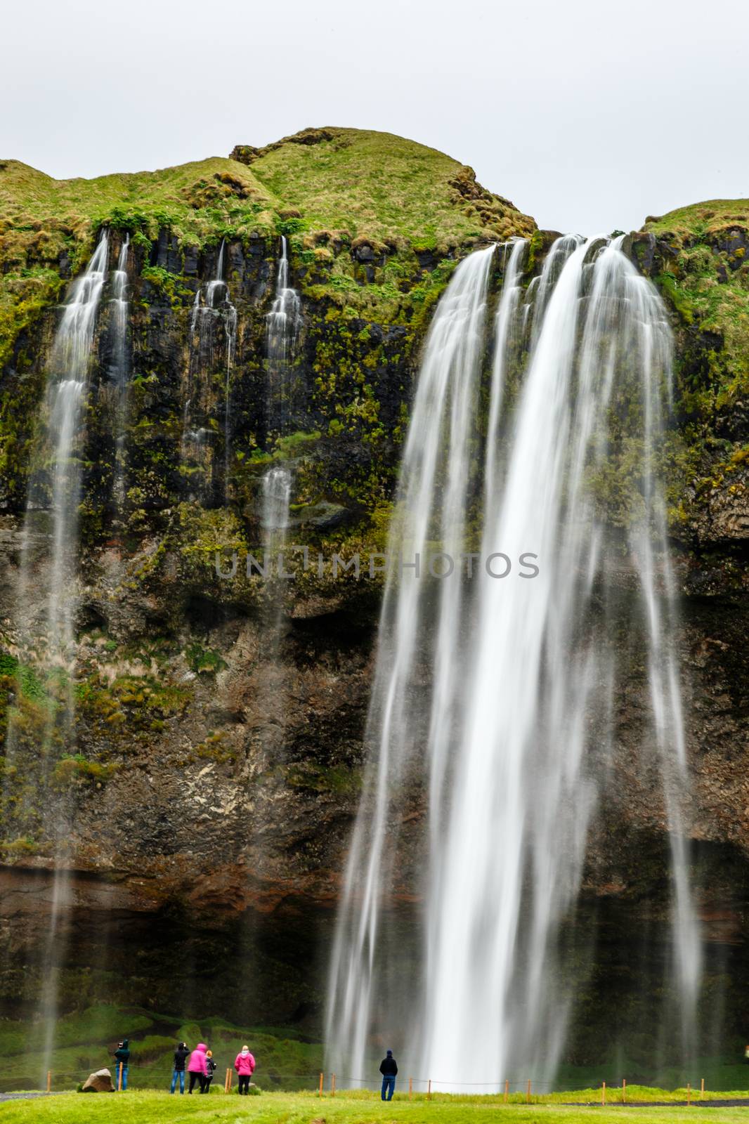 Stream of Seljalandfoss waterfall falling from the mountain with by ambeon