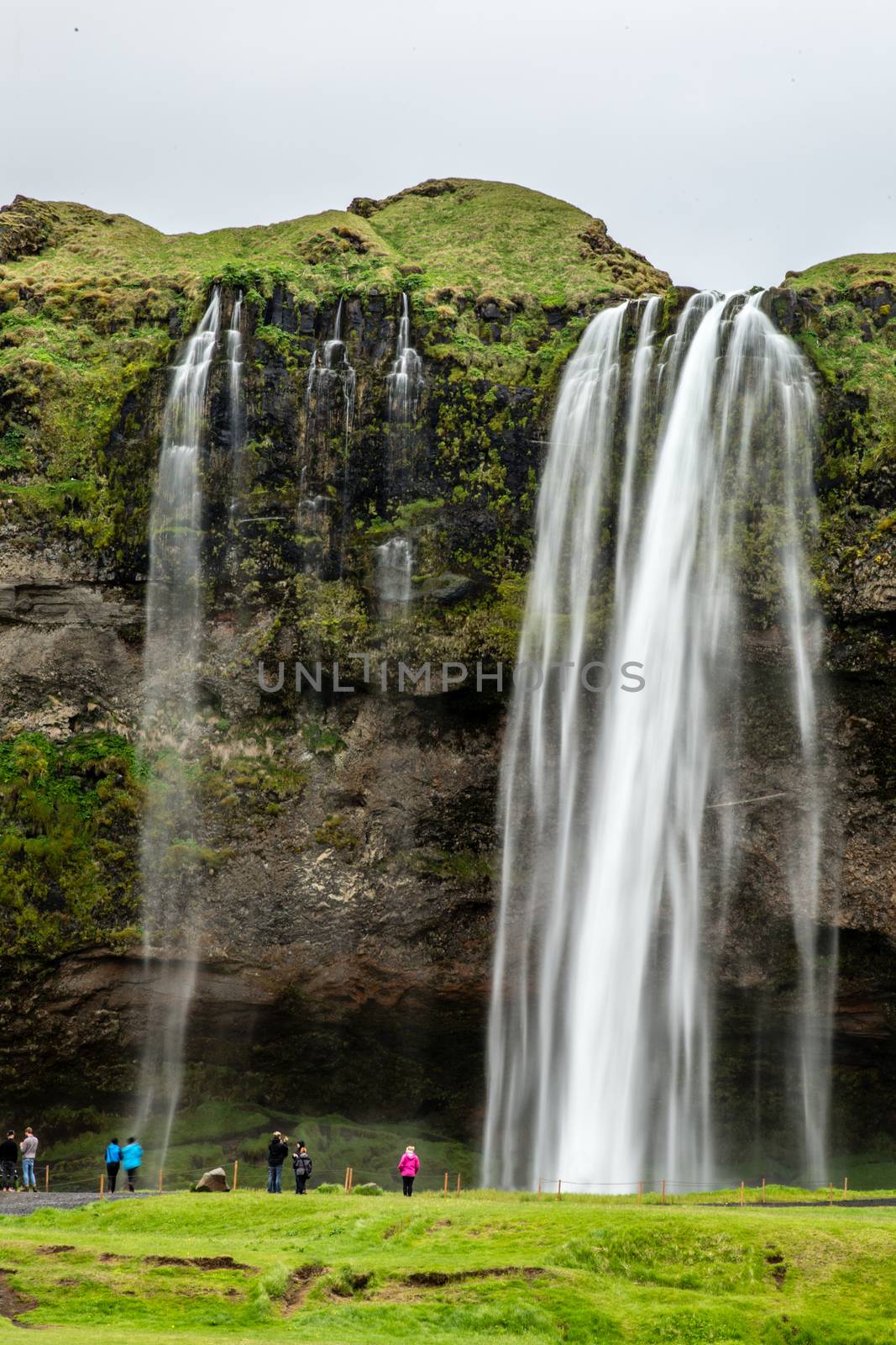 Stream of Seljalandfoss waterfall falling from the mountain with by ambeon