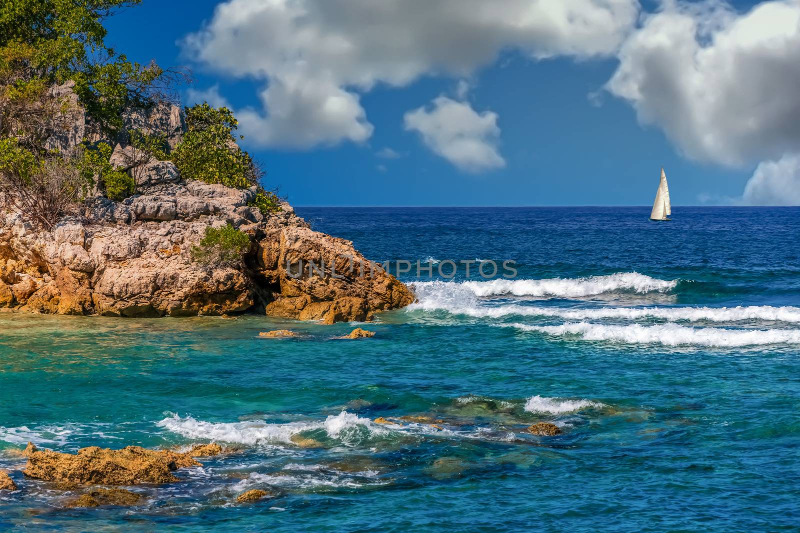 A White Surf Hitting Rocks on an island paradise