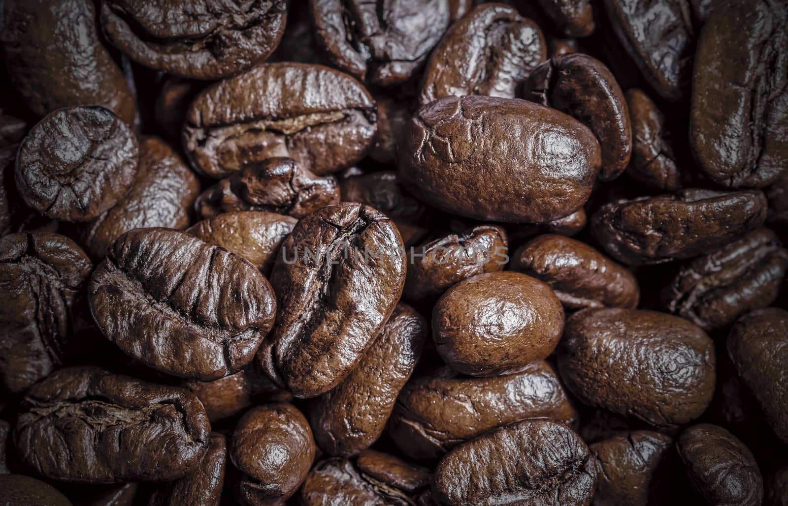 Macro coffee beans texture background by Myimagine