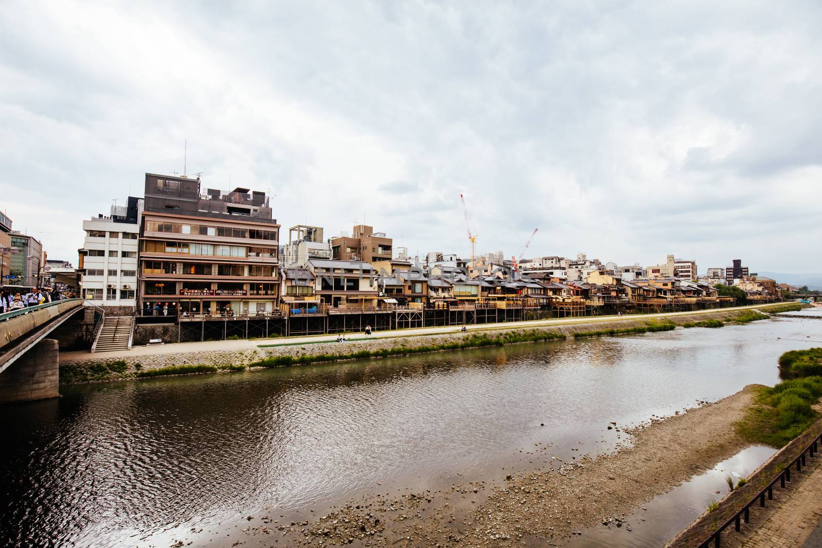 KYOTO, JAPAN - May 14 2019: Ancient houses and restaurants along Kamo river in Gion, Kyoto, Japan