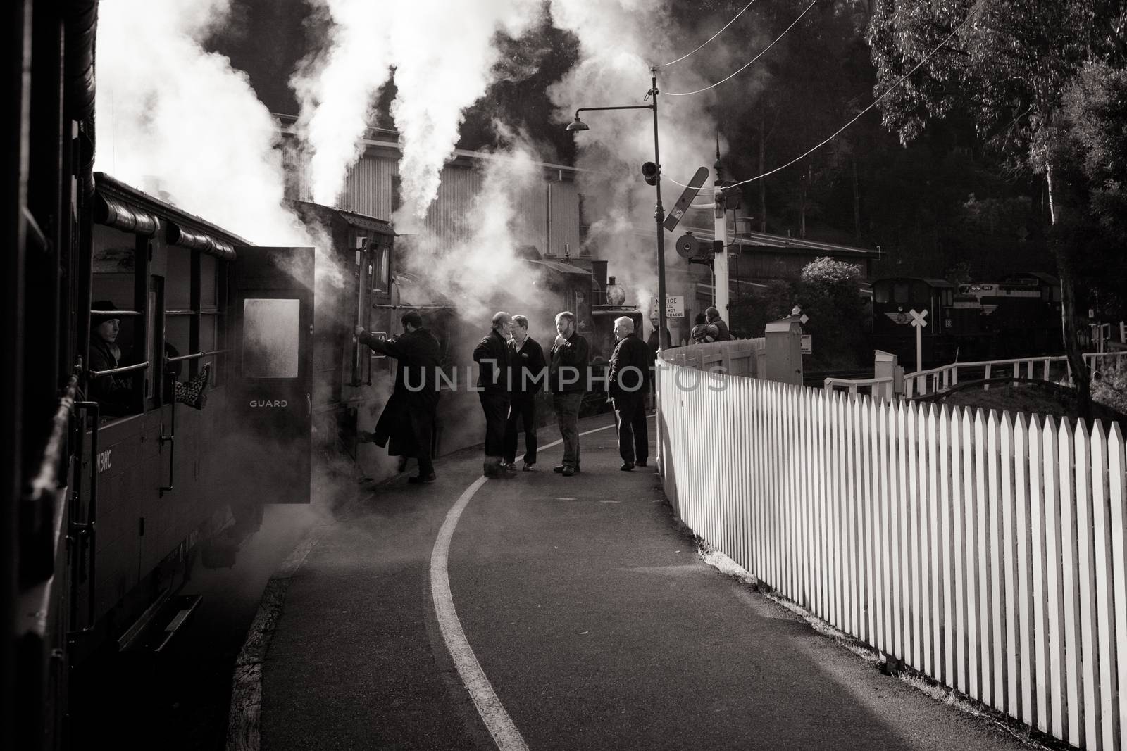 Melbourne, Australia - June 11 2012: Puffing Billy steam train travels across an old wooden bridge in Melbourne, Victoria, Australia