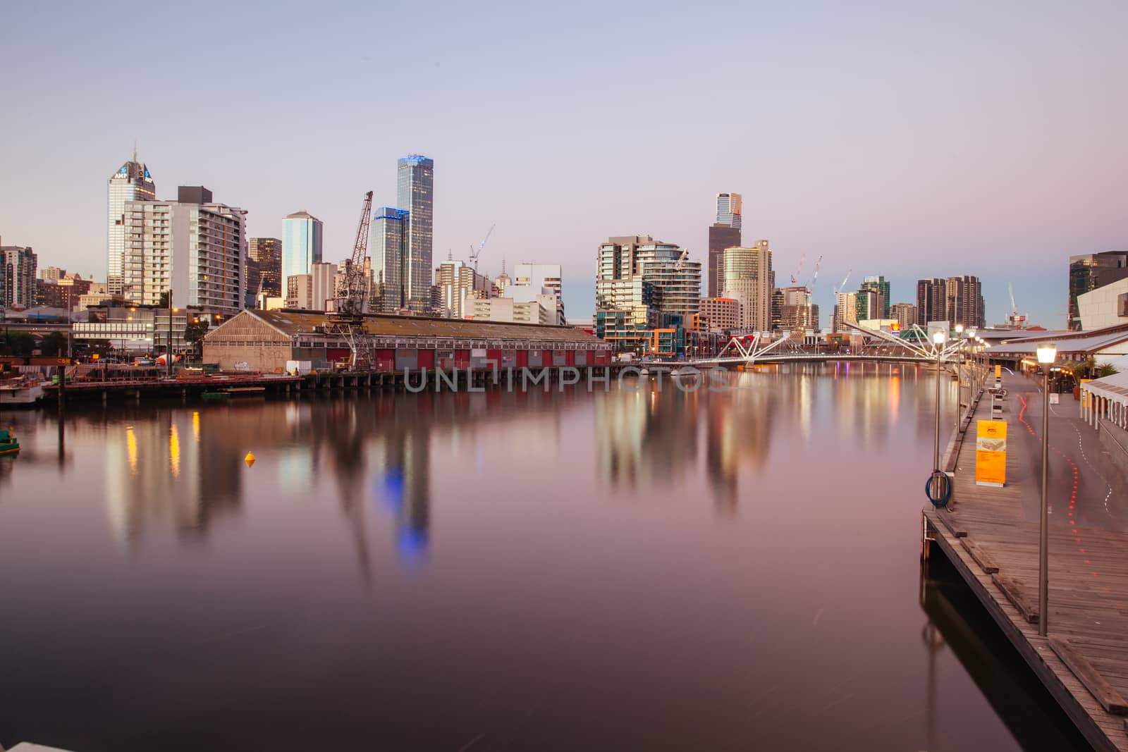 Melbourne, Australia - June 26 2013: Melbourne skyline from South Wharf up the Yarra River at dusk in Melbourne, Victoria, Australia