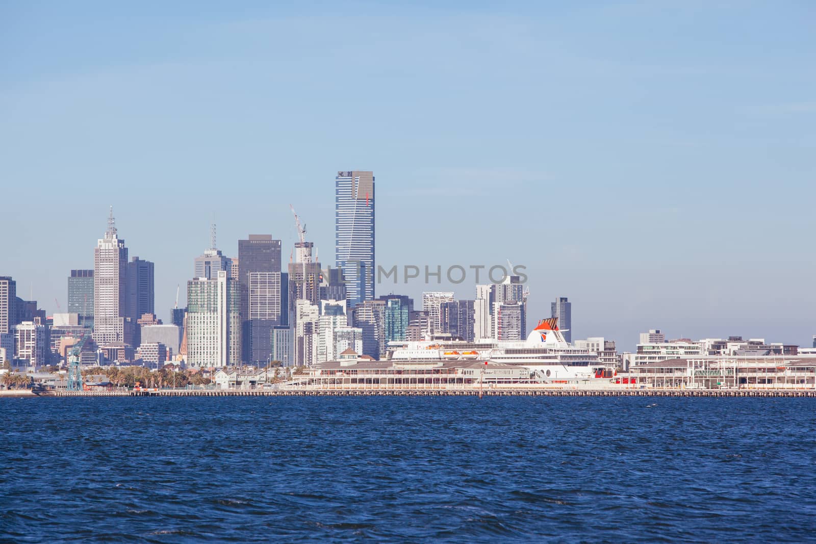 Melbourne skyline with Station Pier and the Spirit of Tasmania boat in dock on a summer's day from Port Phillip Bay