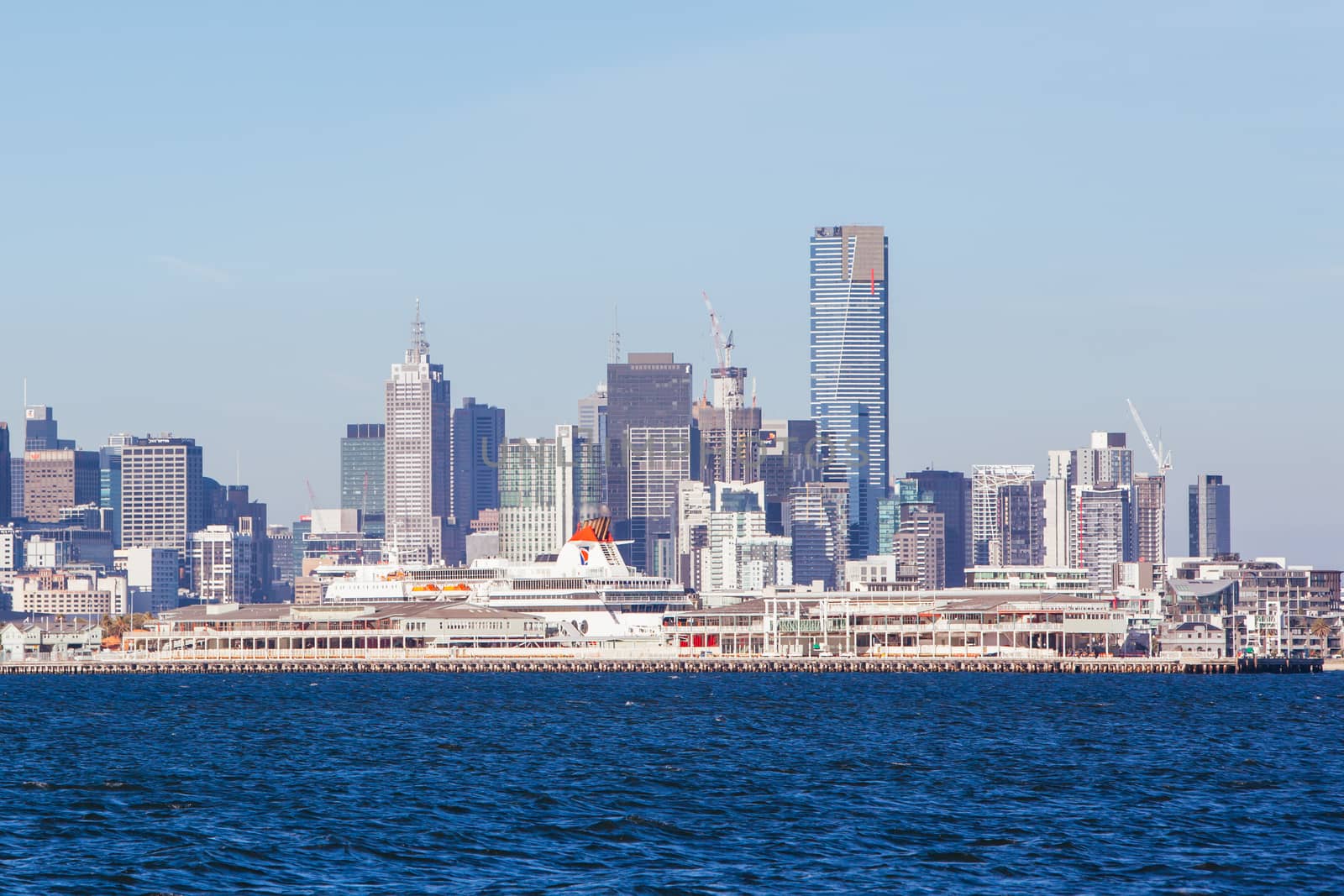 Melbourne skyline with Station Pier and the Spirit of Tasmania boat in dock on a summer's day from Port Phillip Bay