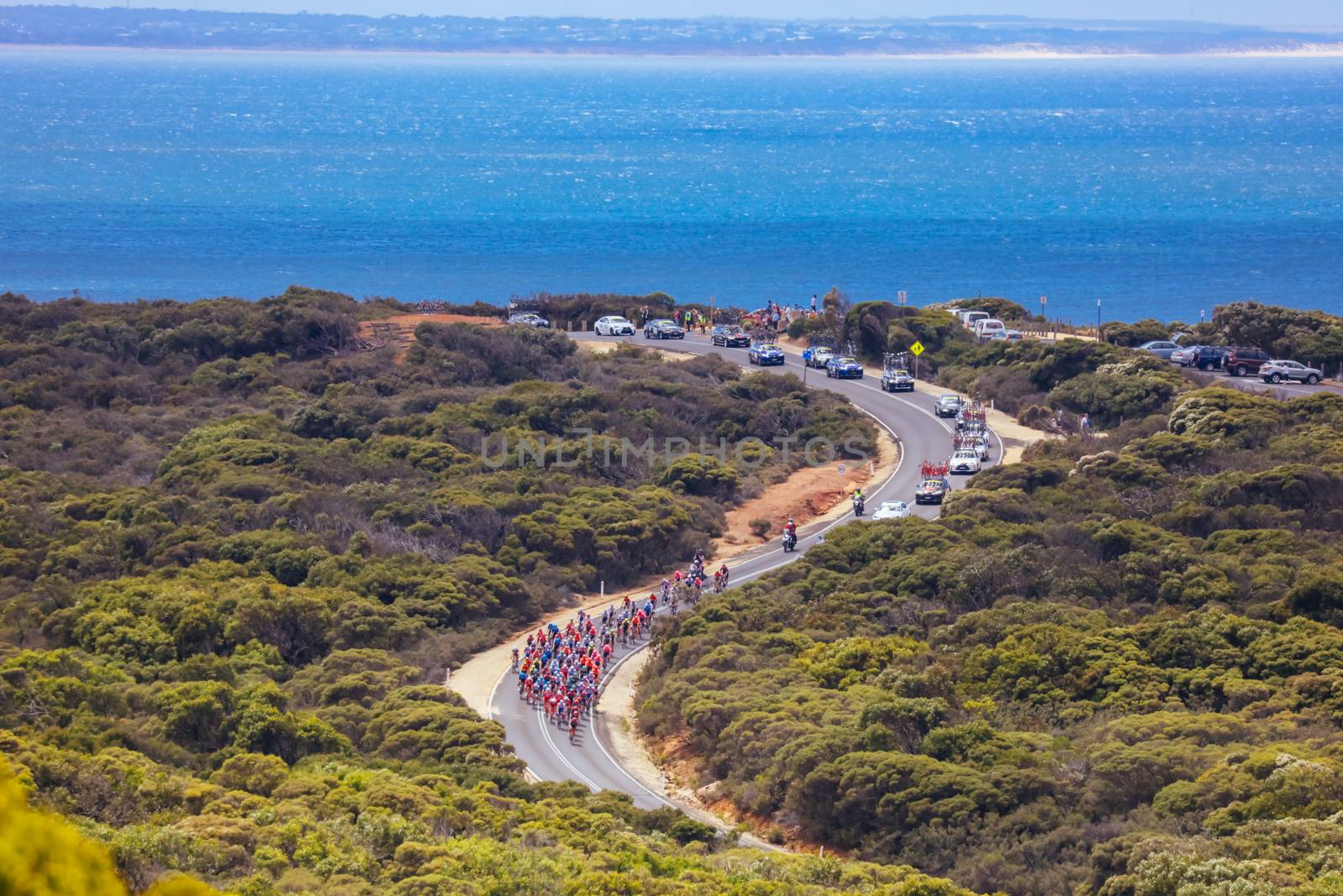 GEELONG, AUSTRALIA - FEBRUARY 2, 2020: The peloton rounds Bells Beach during the 2020 Cadel Evans Great Ocean Road Race