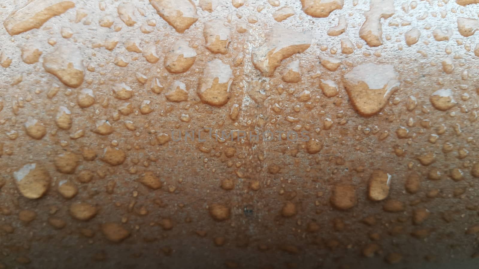 Water drops on wooden floor. Wood table-top having water drops from the rain in rainy season
