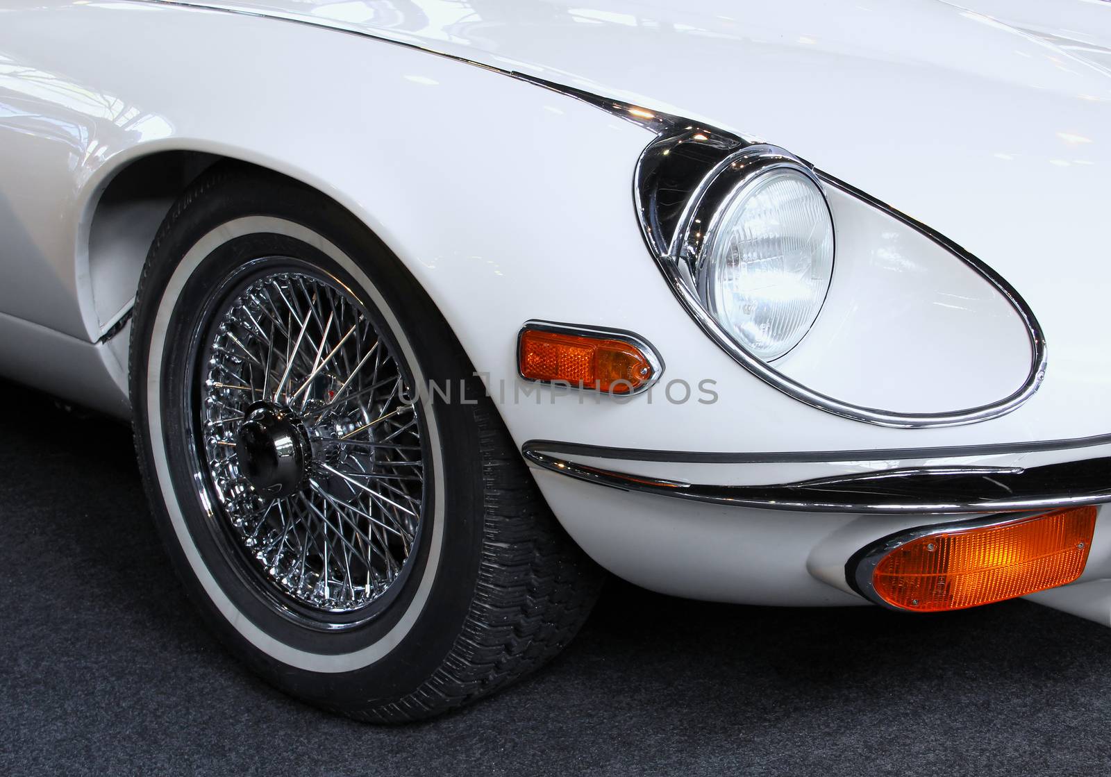 50s white car headlight close-up.