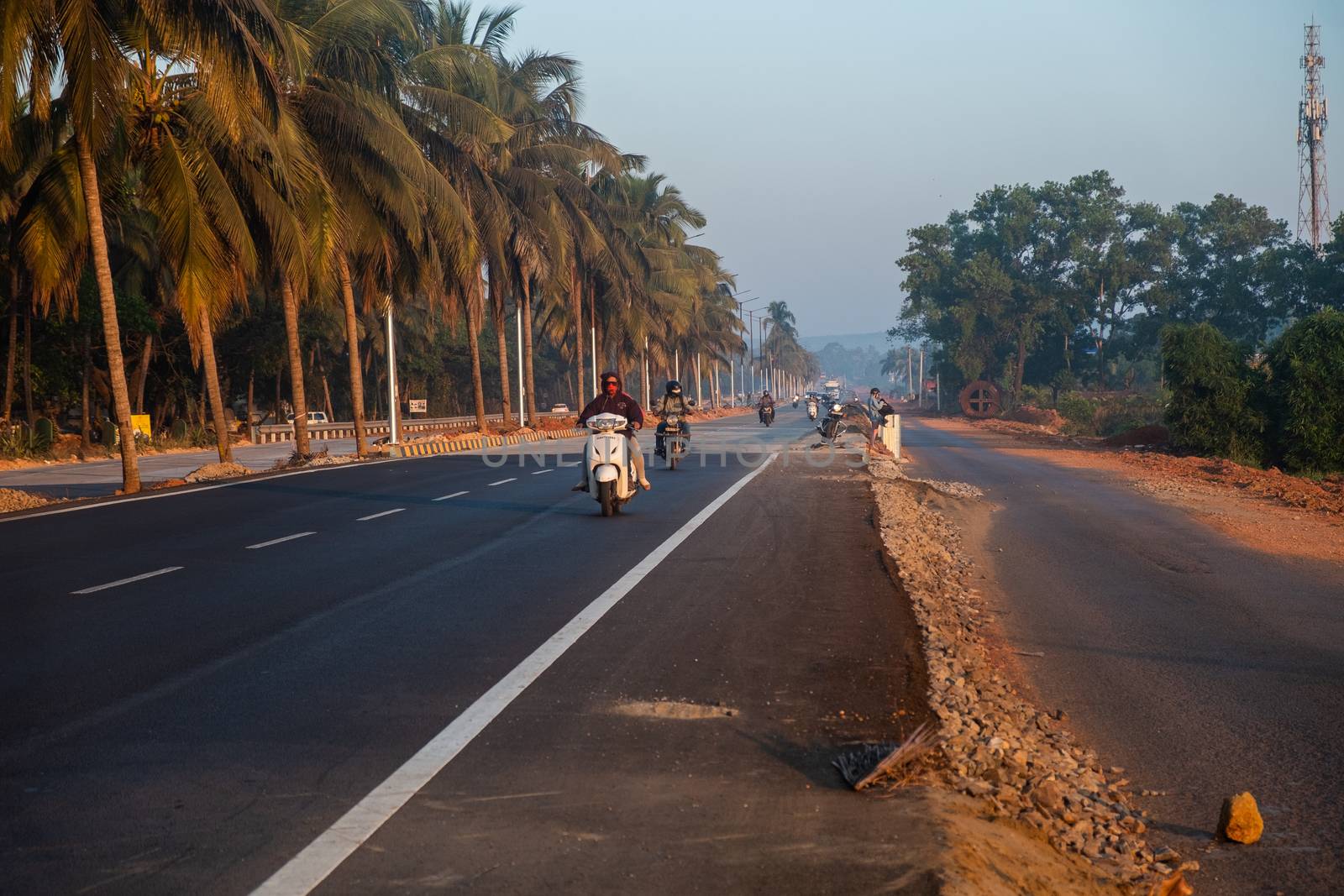 Morning Road Amidst Trees with motorcyclists by snep_photo