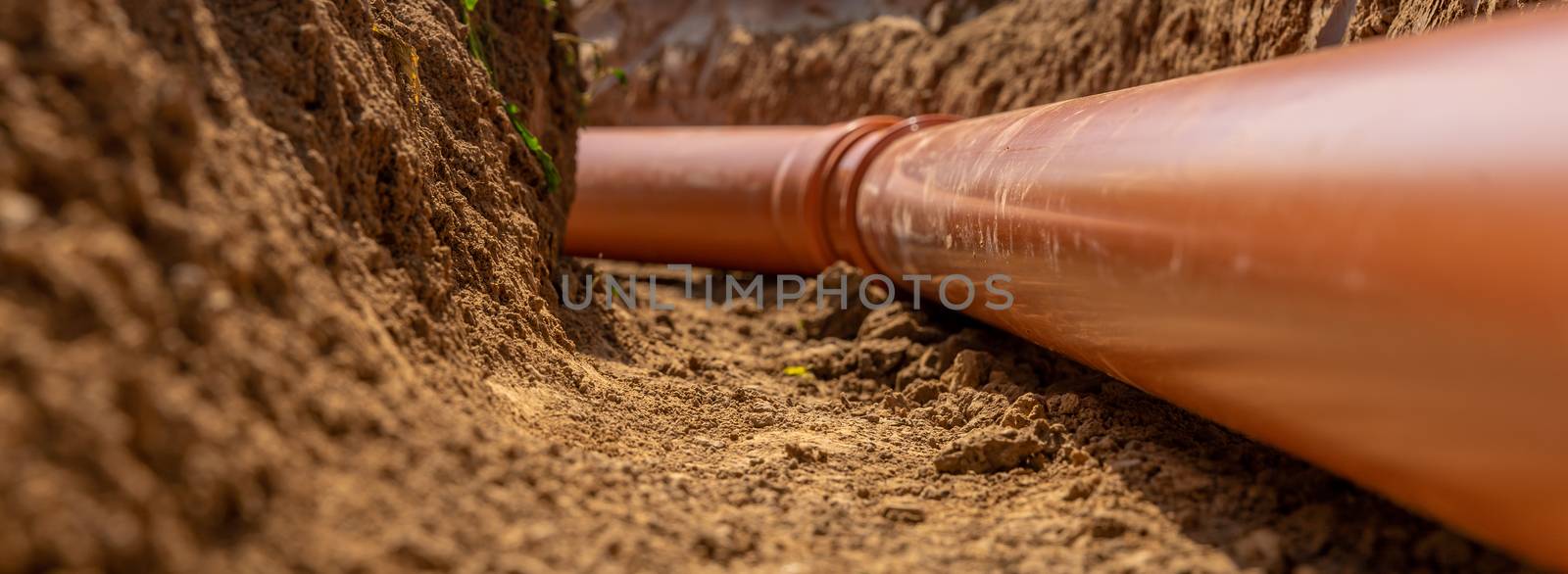 Plastic pipes in the ground during the construction of a building