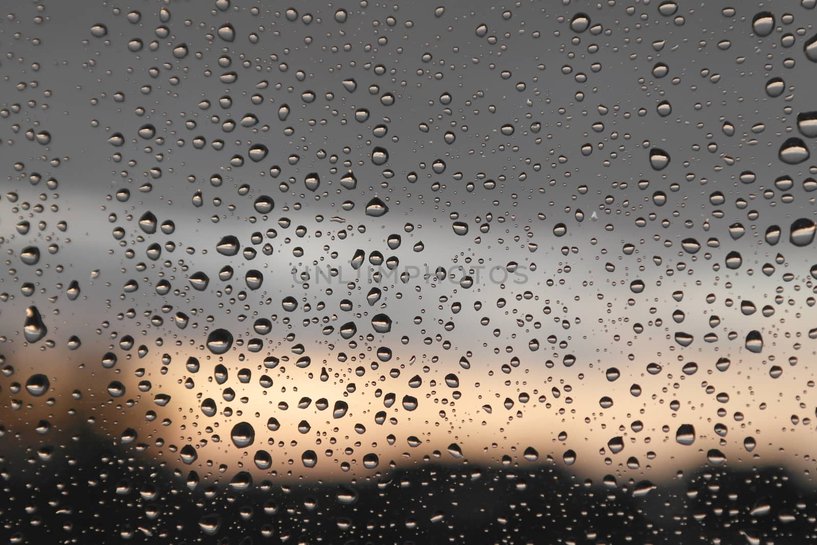 Drops of rain on the window, rainy day. Shallow DOF