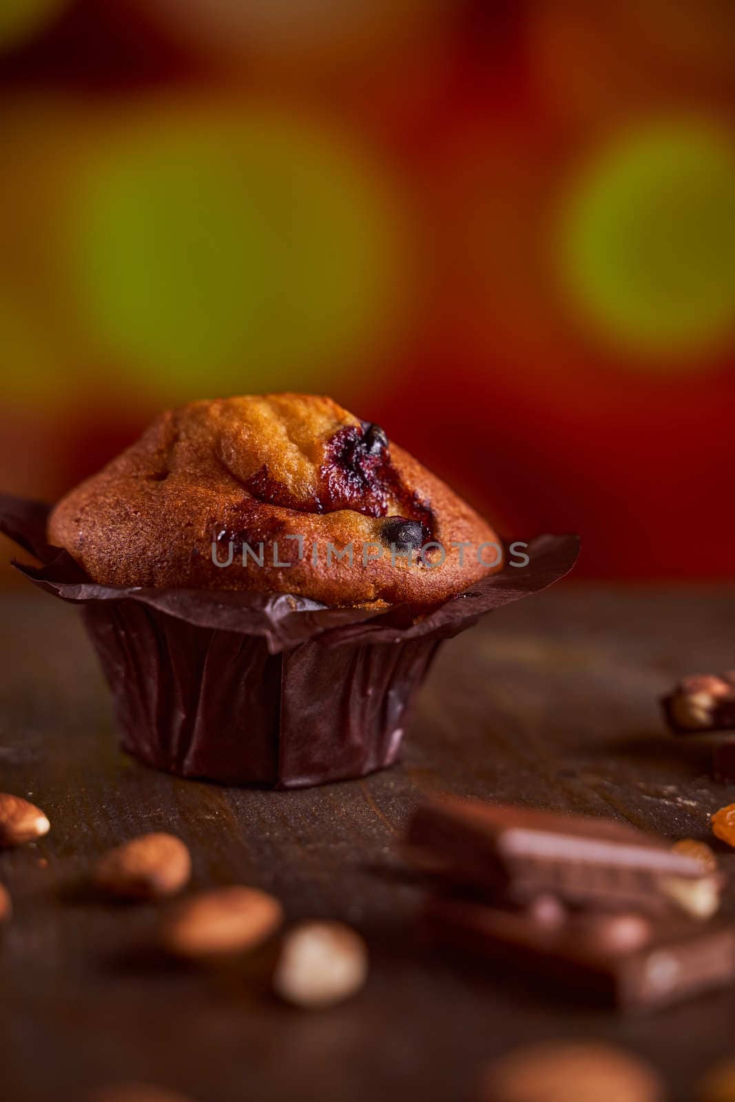 Chocolate maffin on a wooden table with chocolate and tartallini . High quality photo