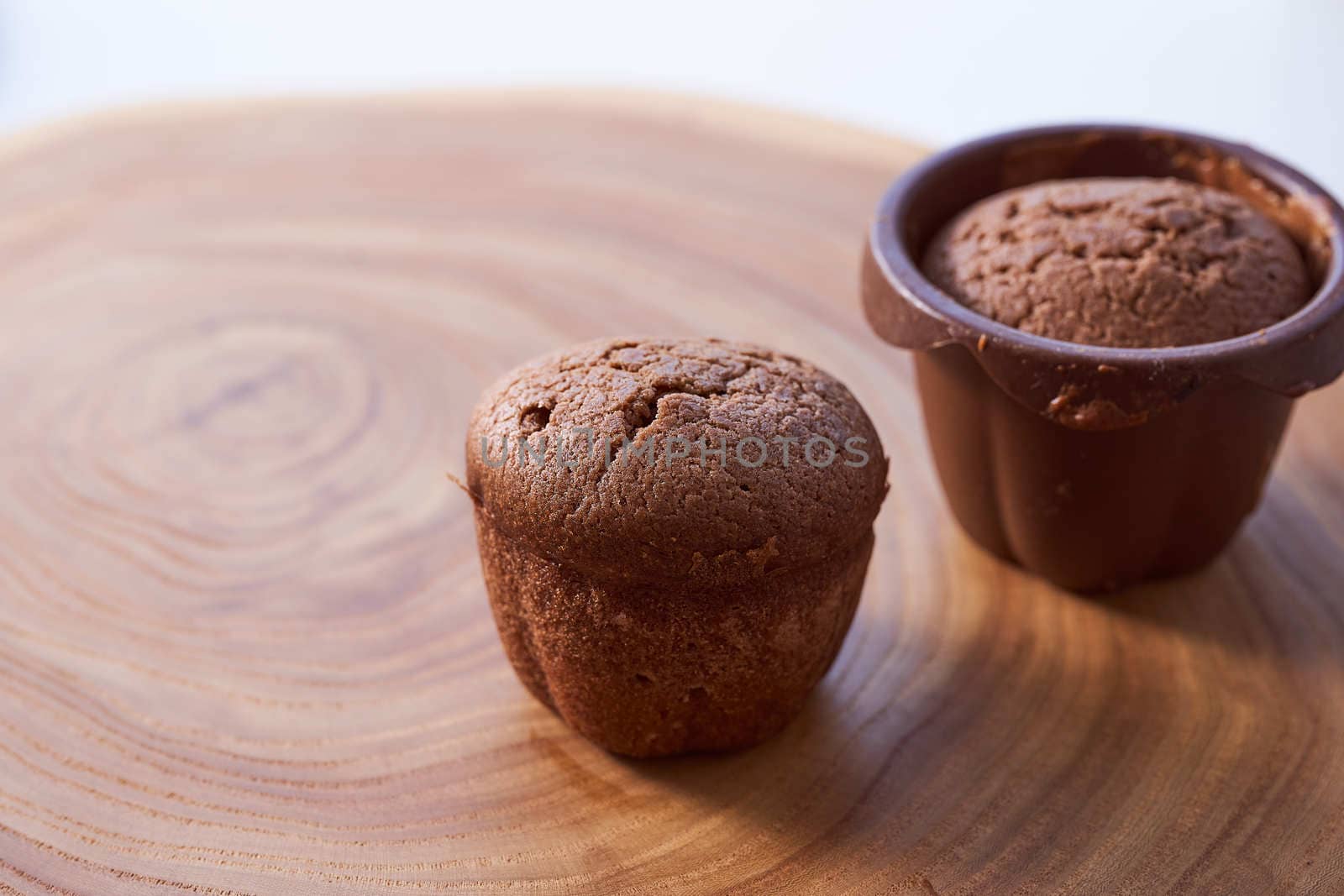 Homemade chocolate cupcakes on a wooden table. High quality photo