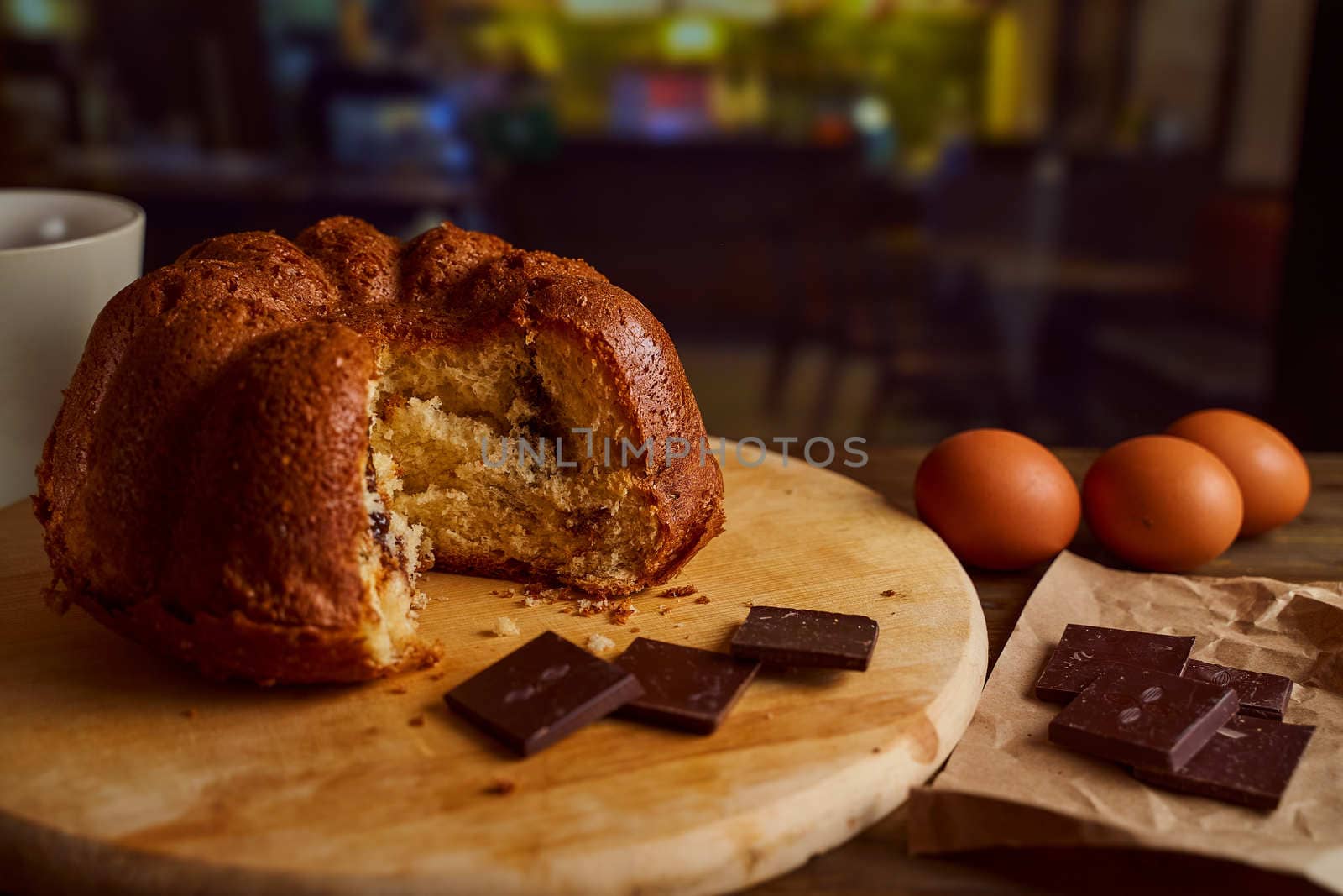 Cut homemade cupcake with chocolate cream inside on a wooden board. High quality photo