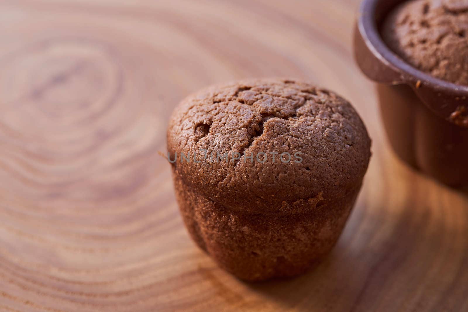 Homemade chocolate cupcakes on a wooden table. High quality photo