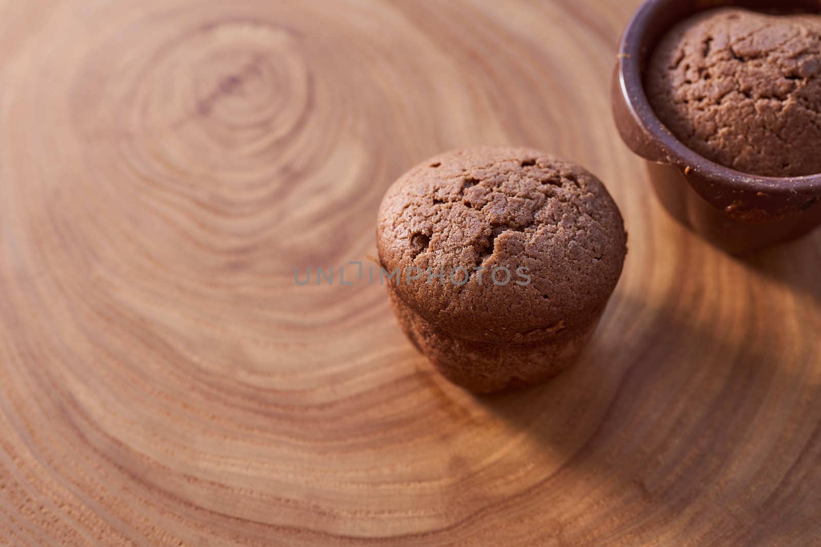 Homemade chocolate cupcakes on a wooden table. High quality photo
