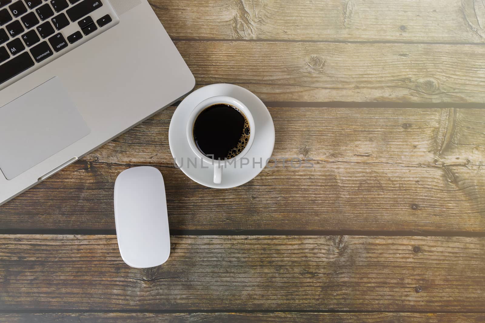 Top view Laptop, mouse, coffee on wood table. Laptop, mouse, espresso coffee on table with copy space banner. Business concept.