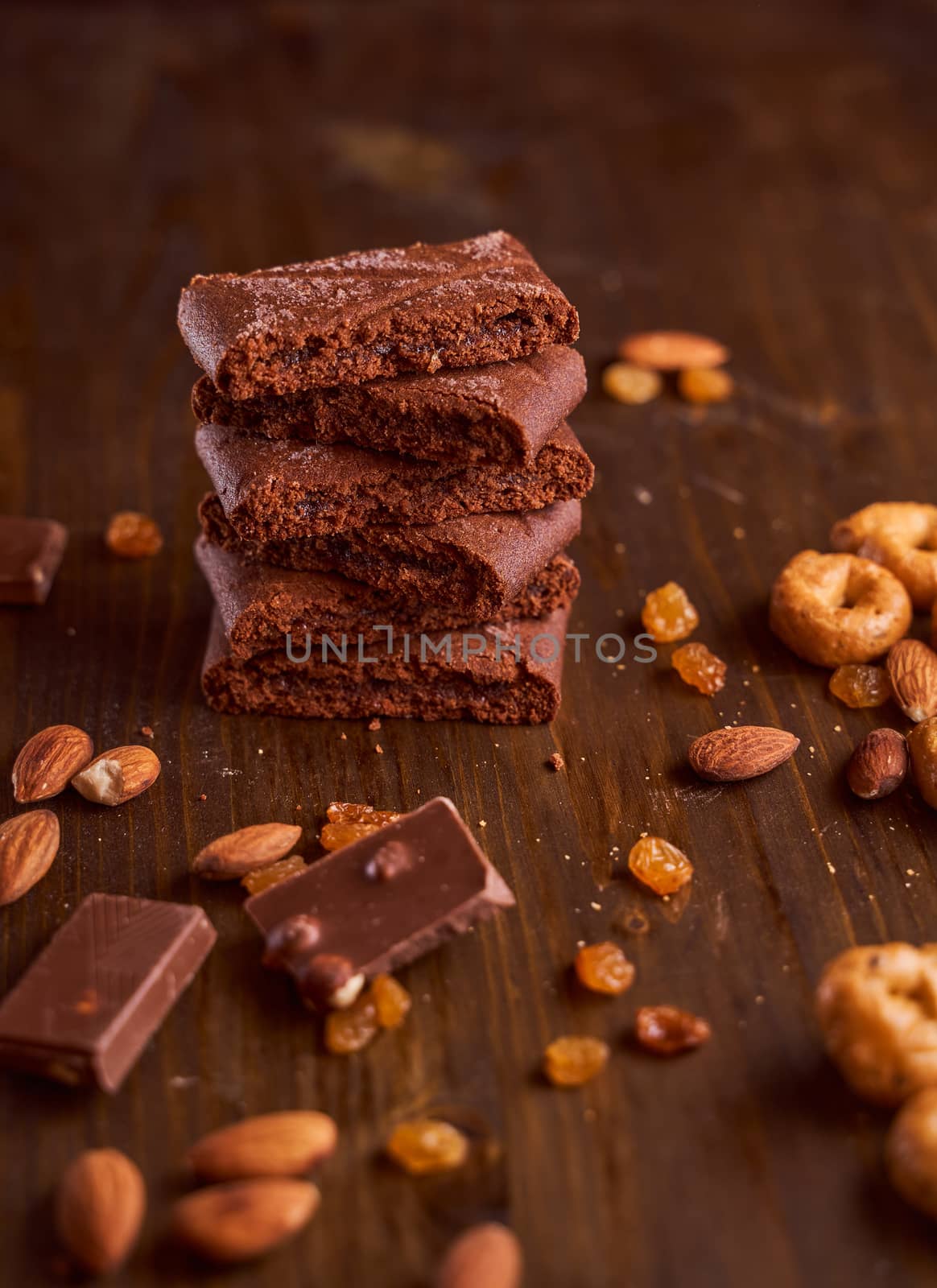 Chocolate cakes stacked on a wooden table. High quality photo