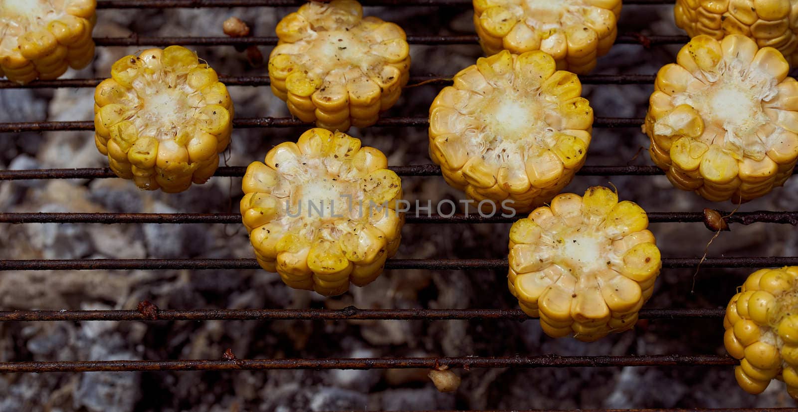 Yellow corn lies on the grill. Top view. With copy space. High quality photo