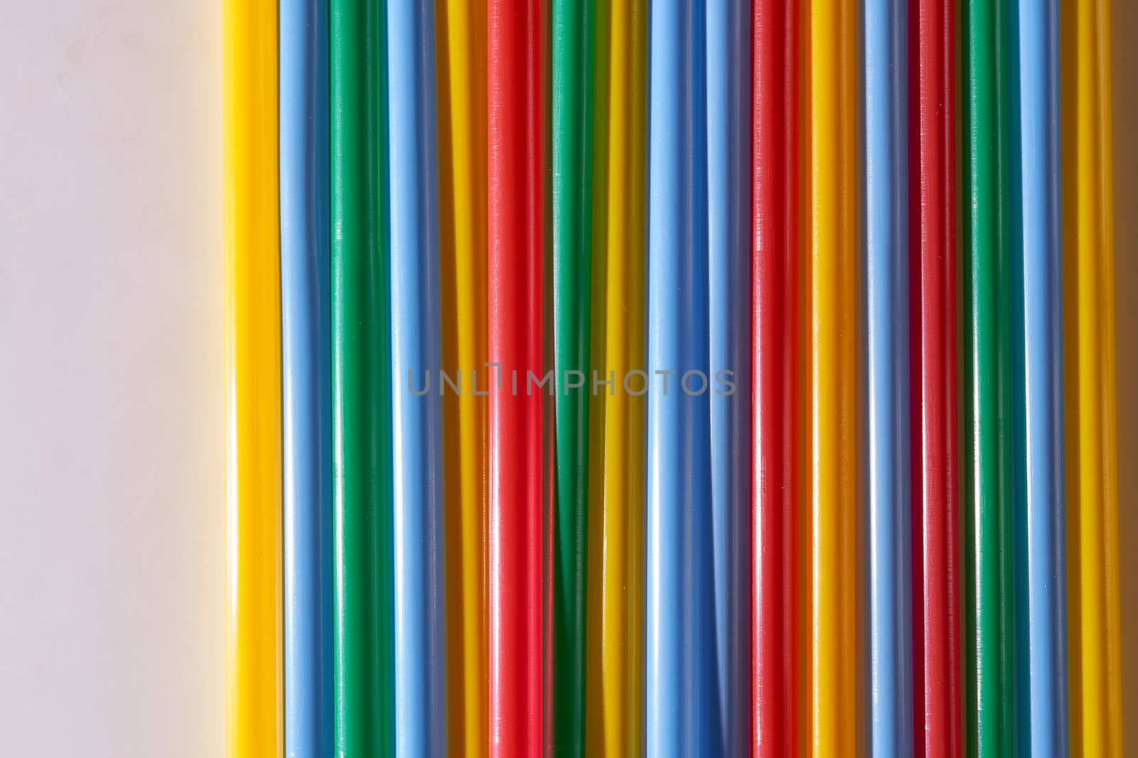 Abstract Background Multicolored Plastic Drinks Tubes. Close-up. High quality photo