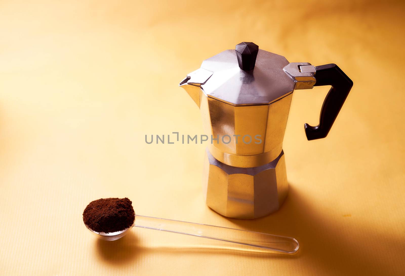  geyser coffee maker with fresh coffee on a yellow background. High quality photo