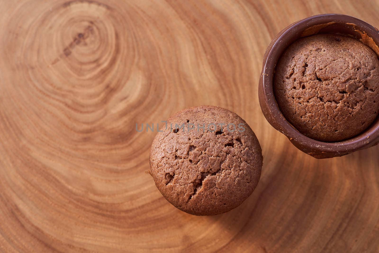Homemade chocolate cupcakes on a wooden table. High quality photo