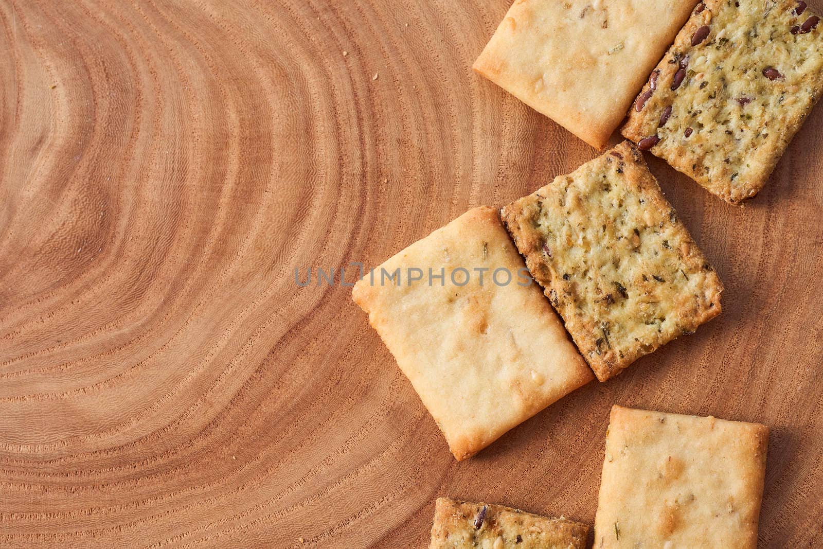 Wheat dry biscuits with spices on a wooden table . High quality photo