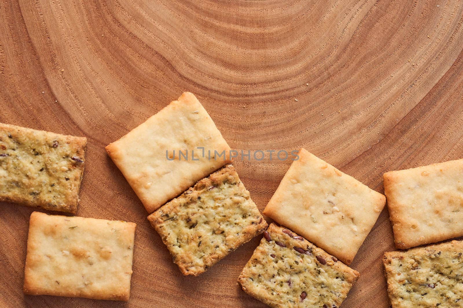 Wheat dry biscuits with spices on a wooden table . High quality photo