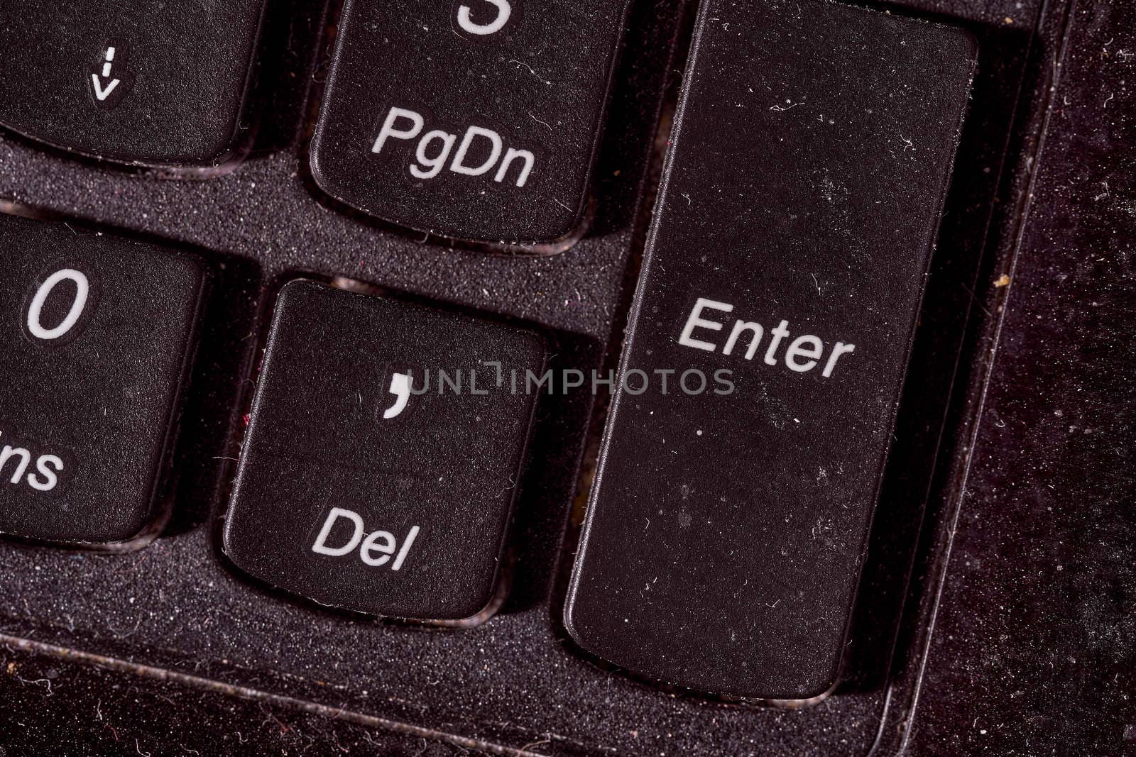 A computer keyboard. Focus on enter button. High quality photo