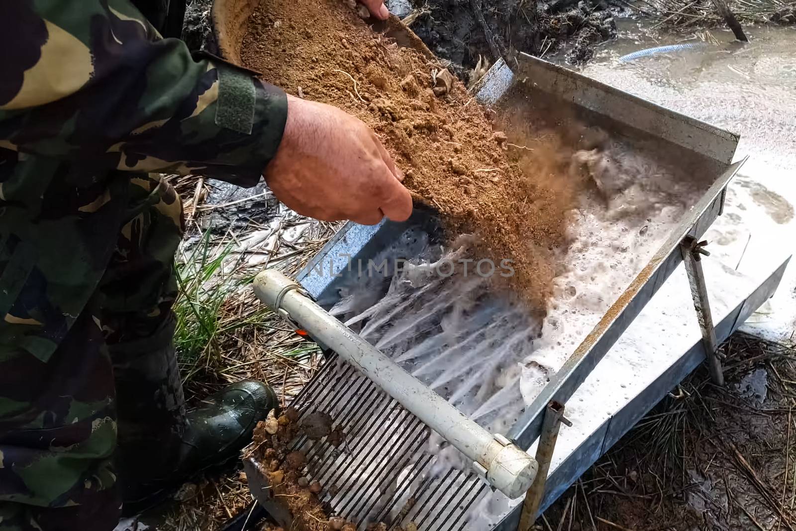 Washing the rock containing gold. Search and extraction of gold.