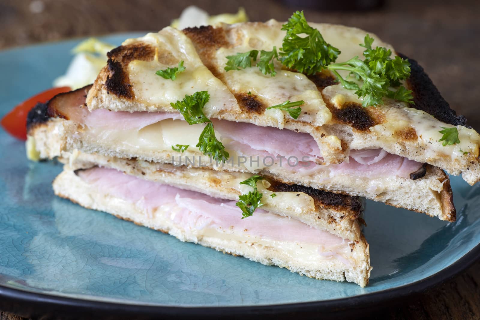 french croque monsieur on a blue plate