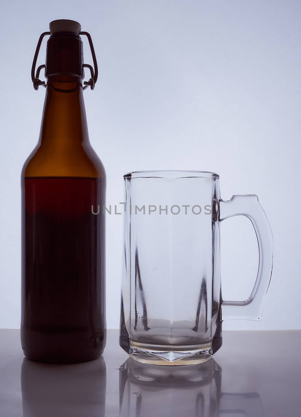 colored silhouette of a beer bottle with a cork on a black white background. Hight quality photo