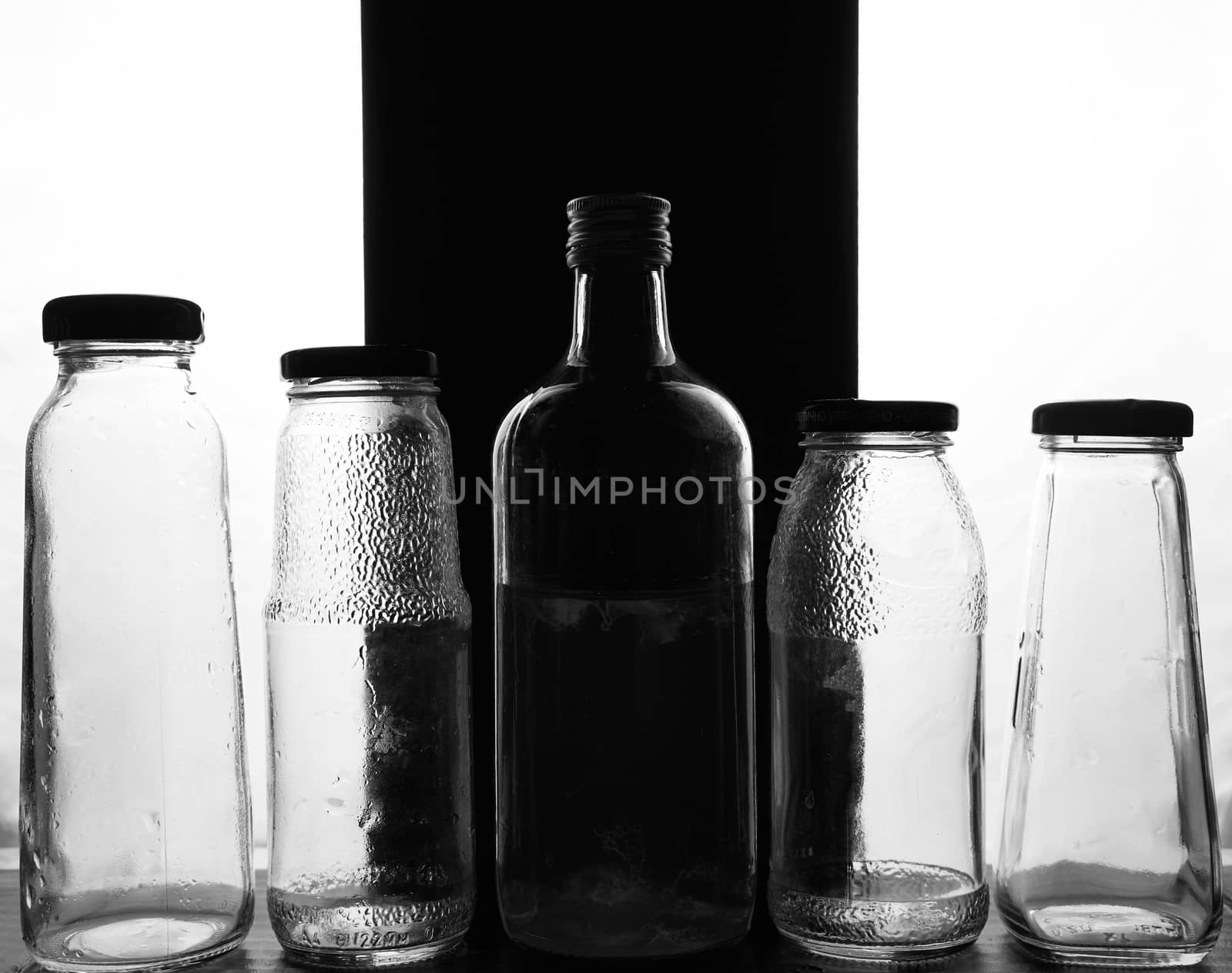 composition of glass bottles on a light background. High quality photo