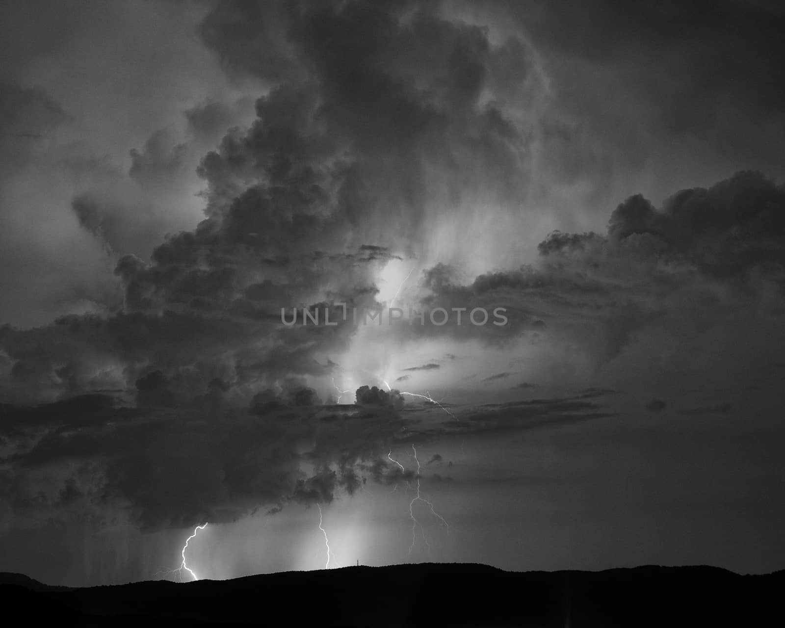 Monochrome view of multiple lightning strikes during summer thunderstorms in western North Carolina.