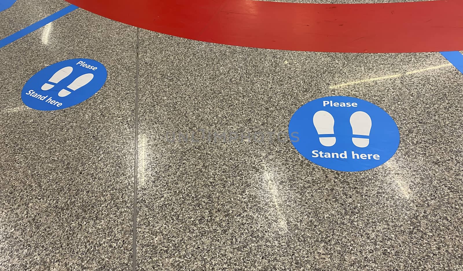 a sticker on the floor that warns to keep social distancing by rarrarorro