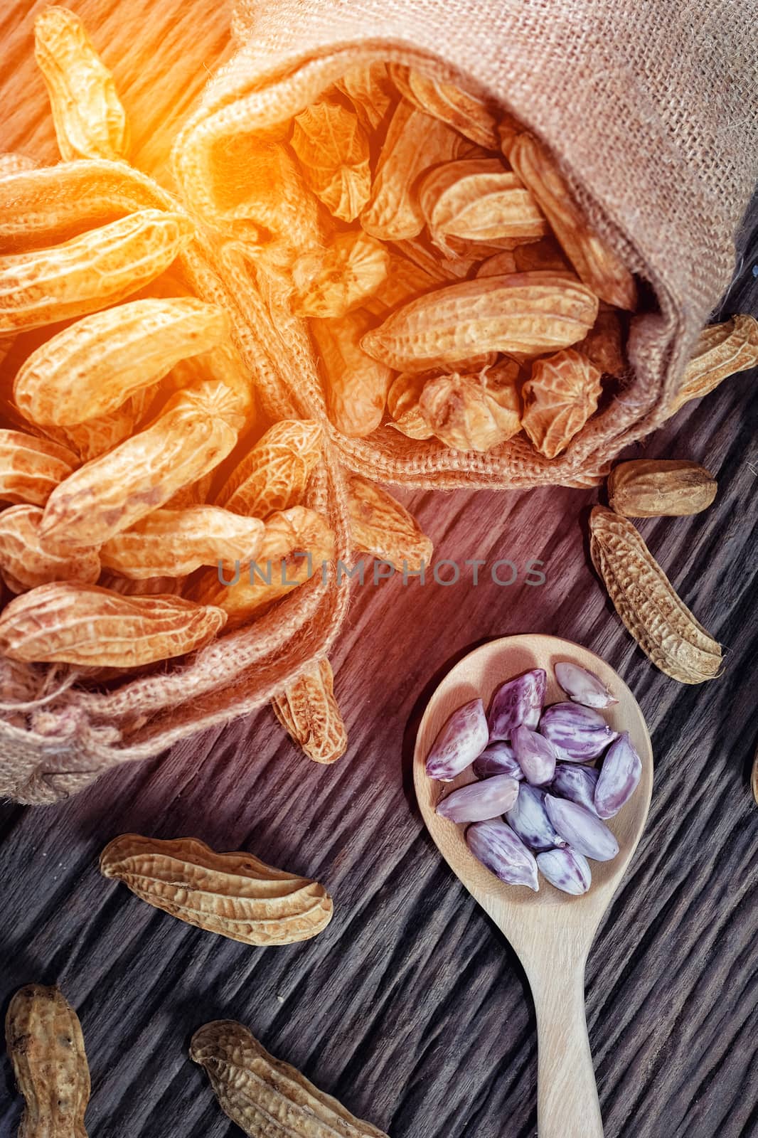 Peanuts on wood background by Surasak