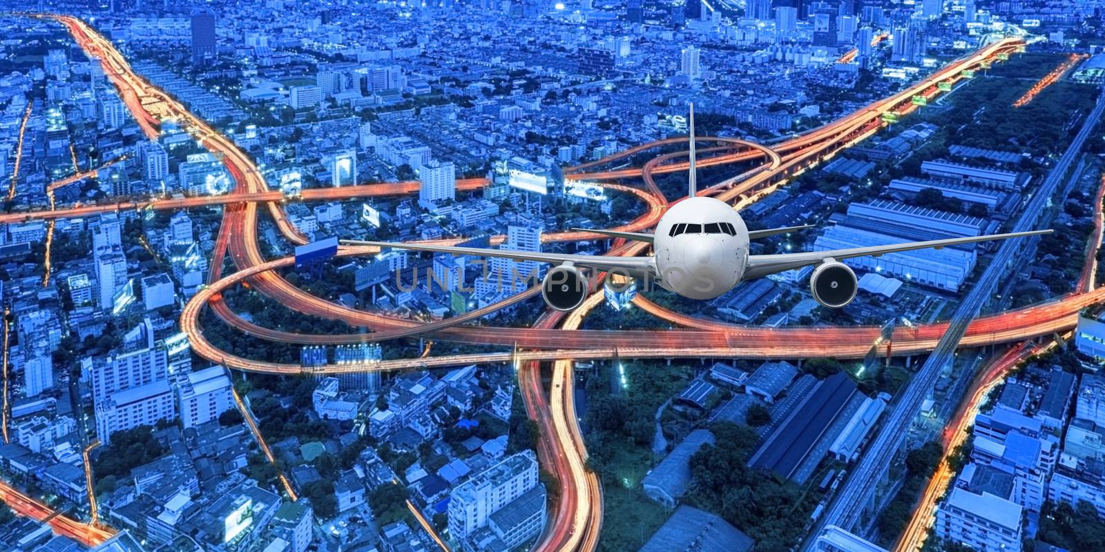 Airplane frying over the cityscape background