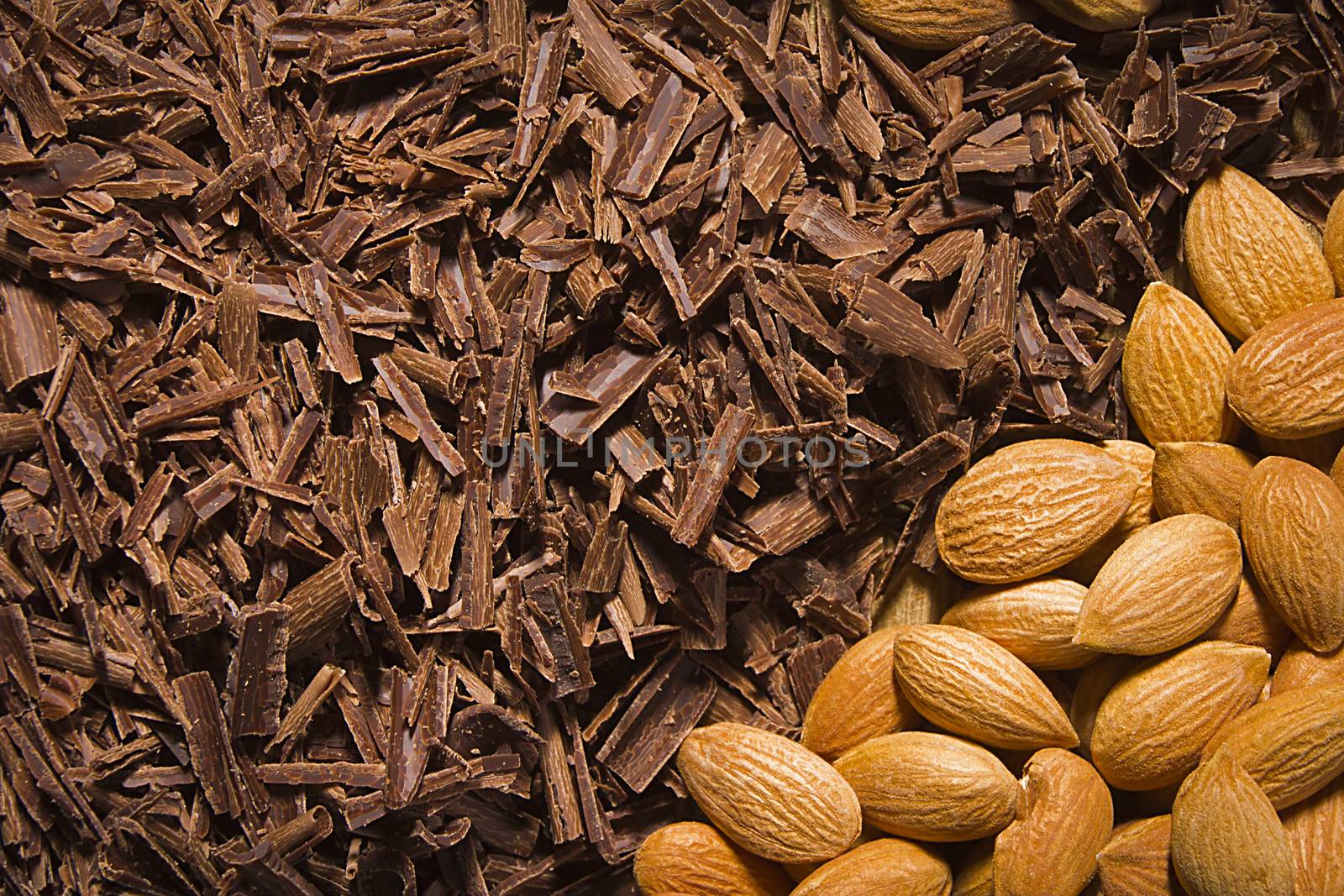 Almond nuts and delicious grated chocolate closeup