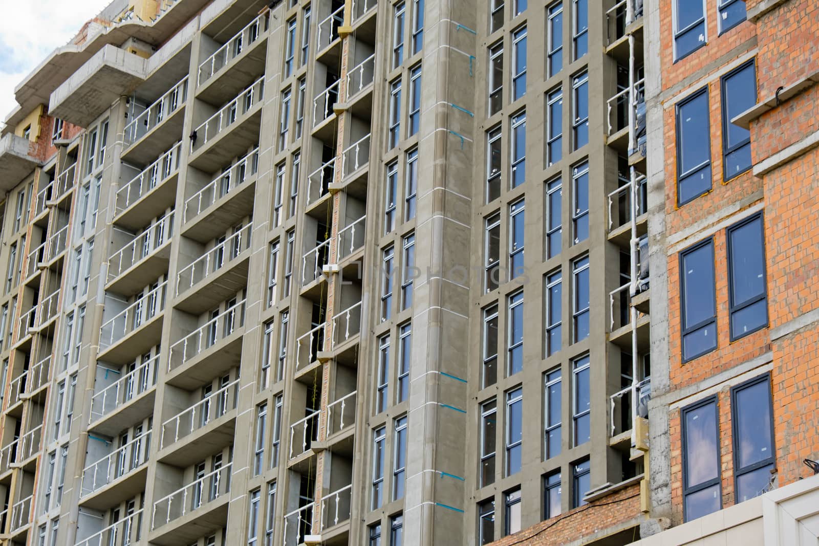 Unfinished new modern high-rise building in the city.