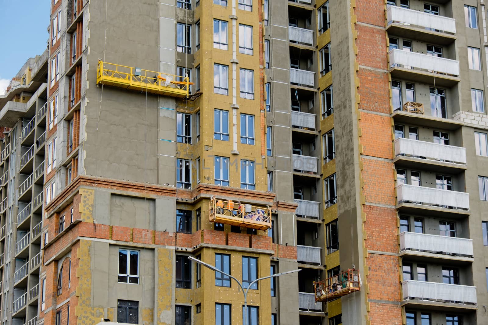 Unfinished new modern high-rise building in the city.