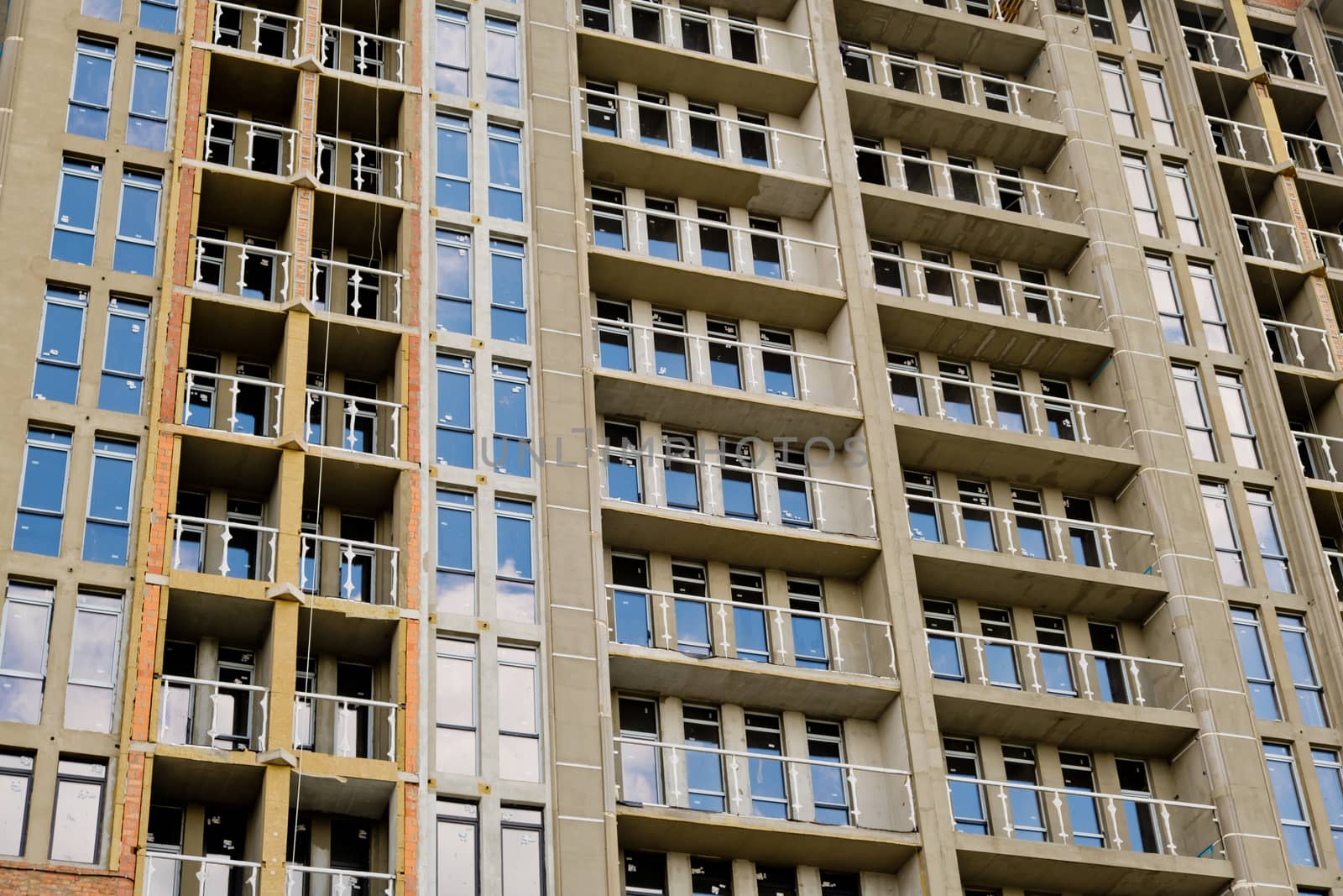 Unfinished new modern high-rise building in the city.