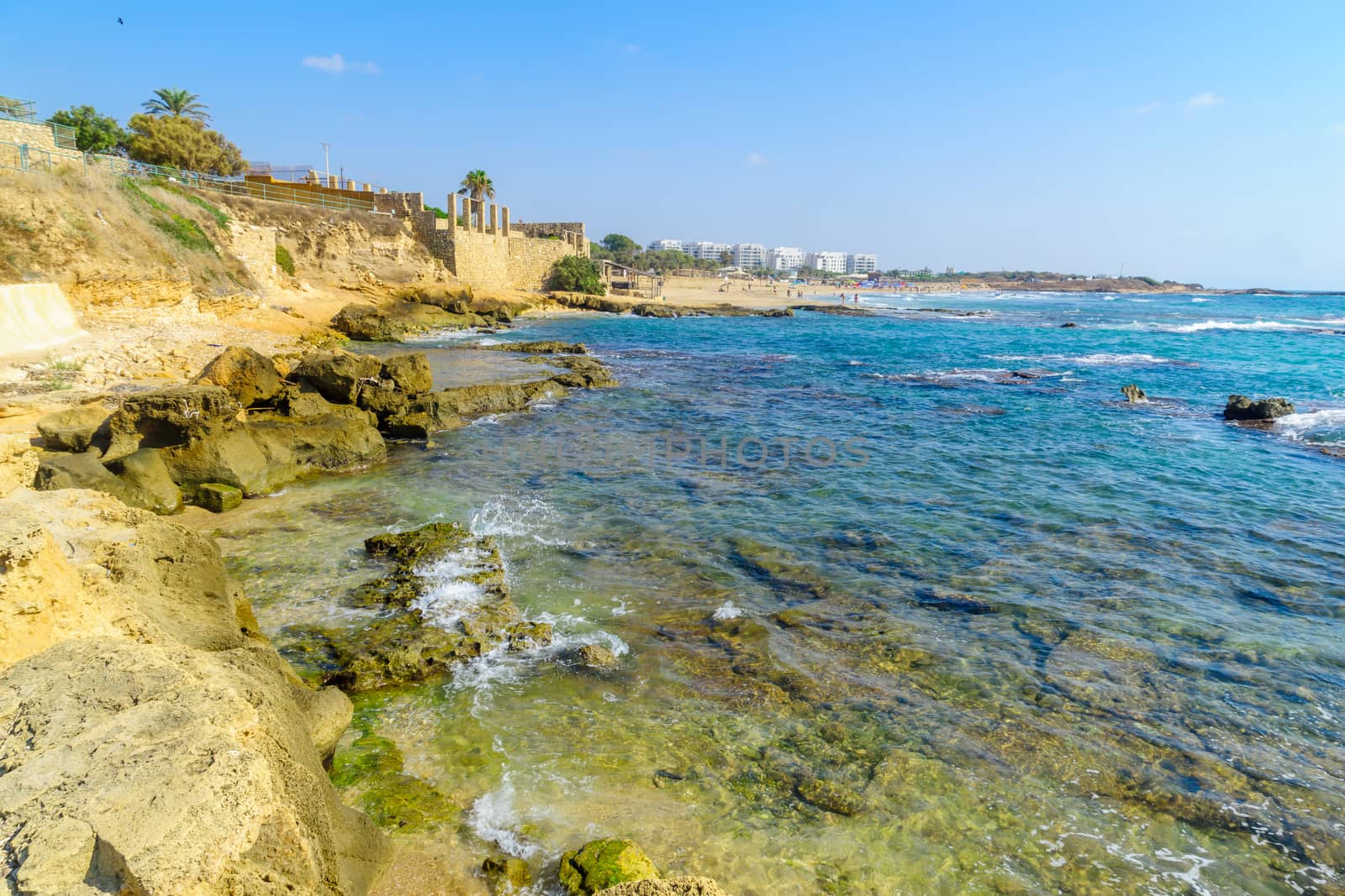 Achziv, Israel - July 22, 2020: View of a bay on the coast, with visitors, in Achziv national park, northern Israel