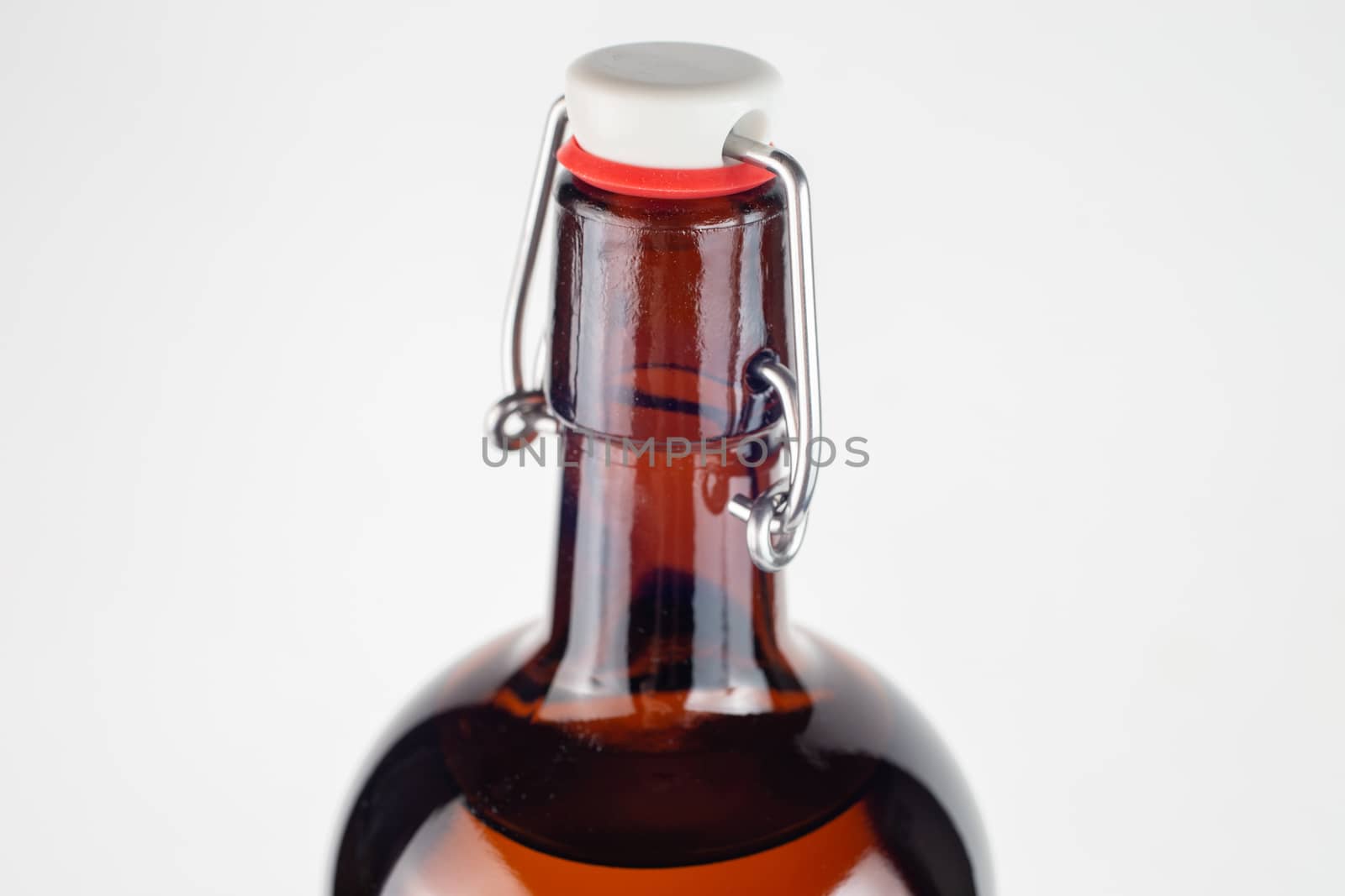 brown bottle swing top or flip-top close-up with selective focus.
