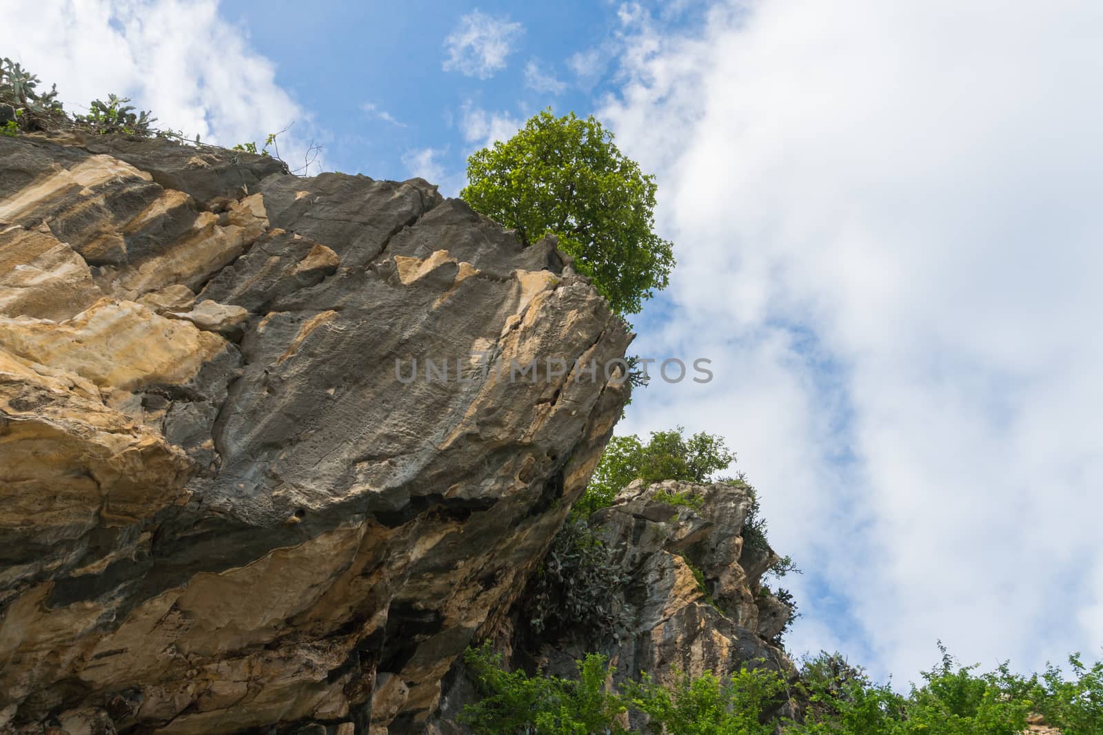 Khao Kalok rock mountain on Khao Kalok beach in Thailand. Natural attractions in Thailand travel. The Khao Kalok rock mountain and green tree 
background
